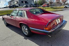 Image result for Sebring Red 1986 Jaguar