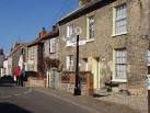 Many of the small houses are faced in distinctive Norfolk flintstones - via Daymix