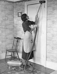 1930 - woman with vacuum in
