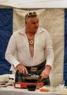 the marquee with an elvis impersonator wearing a kilt for the contest. - via Daymix