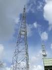Radio masts and water tower near to Great Massingham Norfolk. - via Daymix