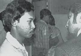 Saderi Abdul Samat was hanged on Oct 18, 1984 for the murder of Salbiah Yeop Abdul Rahman. Saderi Abdul Samat speaking to his counsel K. Kumaraendran. - image