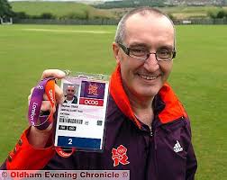 READY FOR ACTION: Steve Grice shows off his pass for the Olympics soccer. - 2012725_121315
