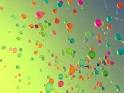 balloons in a green sky