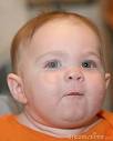 PUDGY BABY WITH RED HAIR