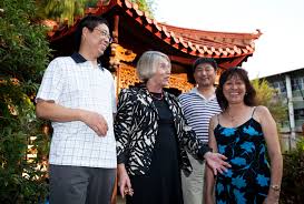 From left: Longwen (Sean) Xiao, Dr Jacques Hou, and Paula Chung joined the celebrations in the Chinese Gardens on Casuarina campus. - 116