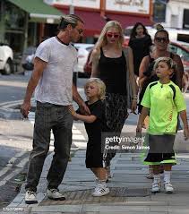 Image result for Queen B by Bumbleride $428 Gwen Stefani and Gavin Rossdale with Kingston and Zuma at the LA zoo