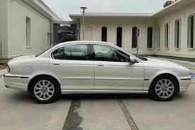 Image result for White Onyx 2002 Jaguar