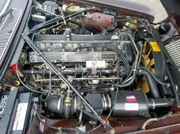 Image result for Burgundy 1983 Jaguar