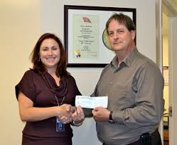 EVC President Jennifer Enderson accepted the donation from Michael Haka of the Knights of Columbus. (Submitted photo). The Emory Valley Center in Oak Ridge ... - knights-chapter-emory-valley-center-donation