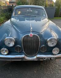 Image result for Silver Blue 1959 Jaguar