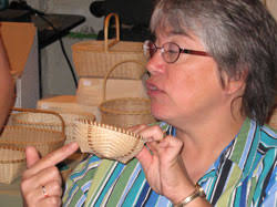 JoAnn Kelly Catsos Basketry Workshop 2008. With the baskets dried to the molds, JoAnn explains how to start the weaving. - jkc28