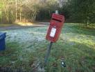 Drunk postbox? I can't believe the wine bottle was left there on purpose. - via Daymix