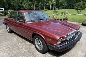 Image result for Sebring Red 1986 Jaguar
