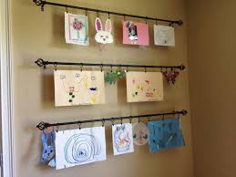 Kids Art Wall - used curtain rods with clip rings so can adjust ...