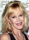 MELANIE GRIFFITH pictured with Lion family adopted from Church of.