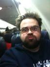 Big fat Kevin Smith on a plane