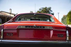 Image result for Sebring Red 1986 Jaguar