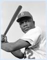 Jackie Robinson posing at bat.