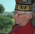 Mark Fortune 65 asleep on the coach wearing the hat he bought in Perge. - WMarkHat