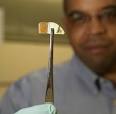 Vanderbilt professor James Dickerson holds up an electrode coated by a ... - nanofilm