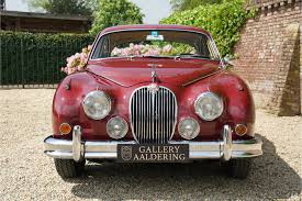 Image result for Maroon 1962 Jaguar