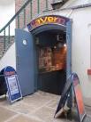 Cavern Club, Exeter. A glimpse inside the doors of the club in Queen's Walk; - via Daymix