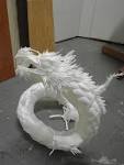 happied  Dragon made entirely of plastic utensils