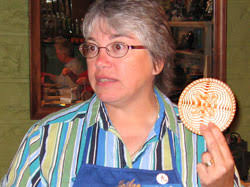 JoAnn Kelly Catsos shows the class the first basket they will be making, ... - jkc02