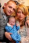 He is pictured here with his parents David Houghton and Leanne Ward - article-1365571-0D9508D4000005DC-999_468x684