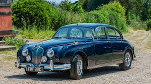 Image result for Dark Blue 1965 Jaguar