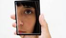 girl looking in mirror image