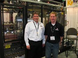 Sales Manager Brad Hanke had the machine in operation at his exhibit and said international visitors were interested in automating packaging equipment in ... - Brad-Hanke-Adam-Wiechmann-Massman-Automation-Designs