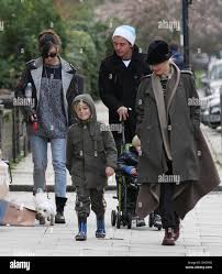 Image result for Queen B by Bumbleride $428 Gwen Stefani and Gavin Rossdale with Kingston and Zuma at the LA zoo