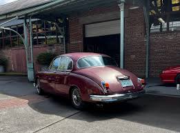 Image result for Maroon 1962 Jaguar
