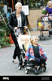 Image result for Queen B by Bumbleride $428 Gwen Stefani and Gavin Rossdale with Kingston and Zuma at the LA zoo