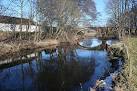 On the left bank are some of the buildings of Easter Calcots Farm, - via Daymix