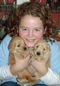 Lauren Earley (at age 9) with Golden Retriever pups - Laurengoldenpups110809