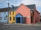 This fairly new building follows the local tradition of bright colourwashing - via Daymix