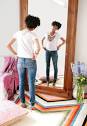 girl looking in mirror image