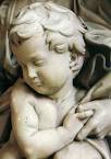 The Bambino clasping His