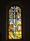 One of a pair of windows designed by Ceri Richards (1965) symbolising "All - via Daymix