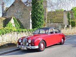 Image result for Maroon 1962 Jaguar