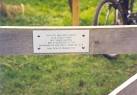 This plaque says: This site was part funded by a legacy from Miss Doris - via Daymix