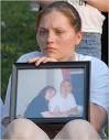 Crystal Dillman with a photograph of her and her fiancé, Luis Ramirez, ... - 05attack_450