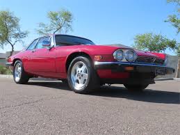 Image result for Sebring Red 1986 Jaguar