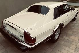 Image result for Nimbus White 1987 Jaguar