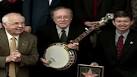 2003: Earl Scruggs added to
