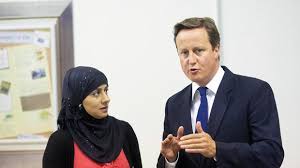 Prime Minister David Cameron talking with Shahida Din during a visit to the A4e (Action For Employment) offices in Brixton, south London, yesterday. - world_04_temp-1315980889-4e704659-620x348
