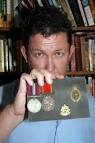 Paul Kirk with Pamela Reid's medal and her signals cap badge. - Fix%20IMG_2004